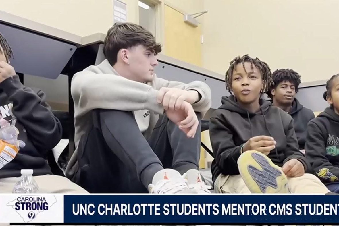 Students sitting on the ground at school