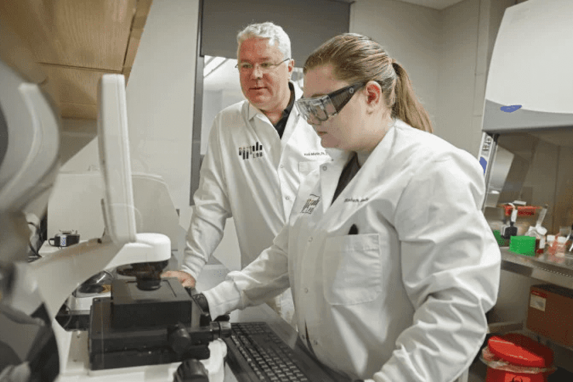 Two faculty members working in a lab