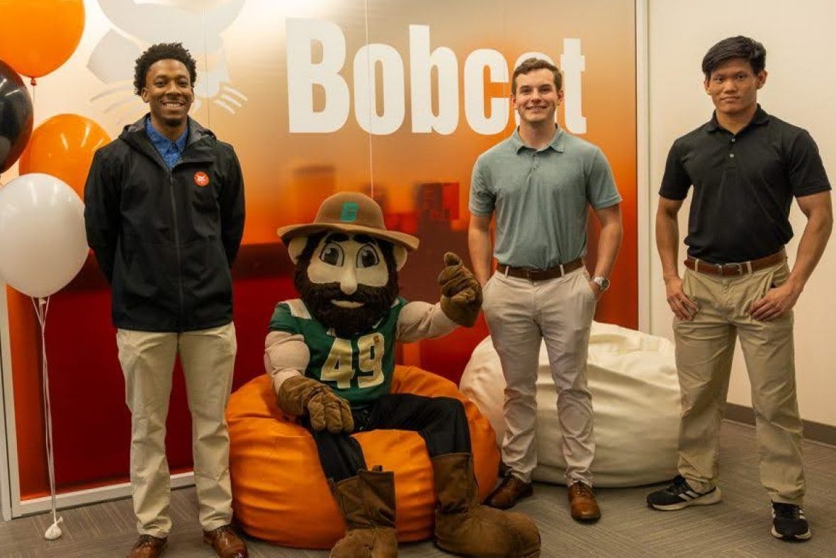 Bobcat employees and Norm the Niner