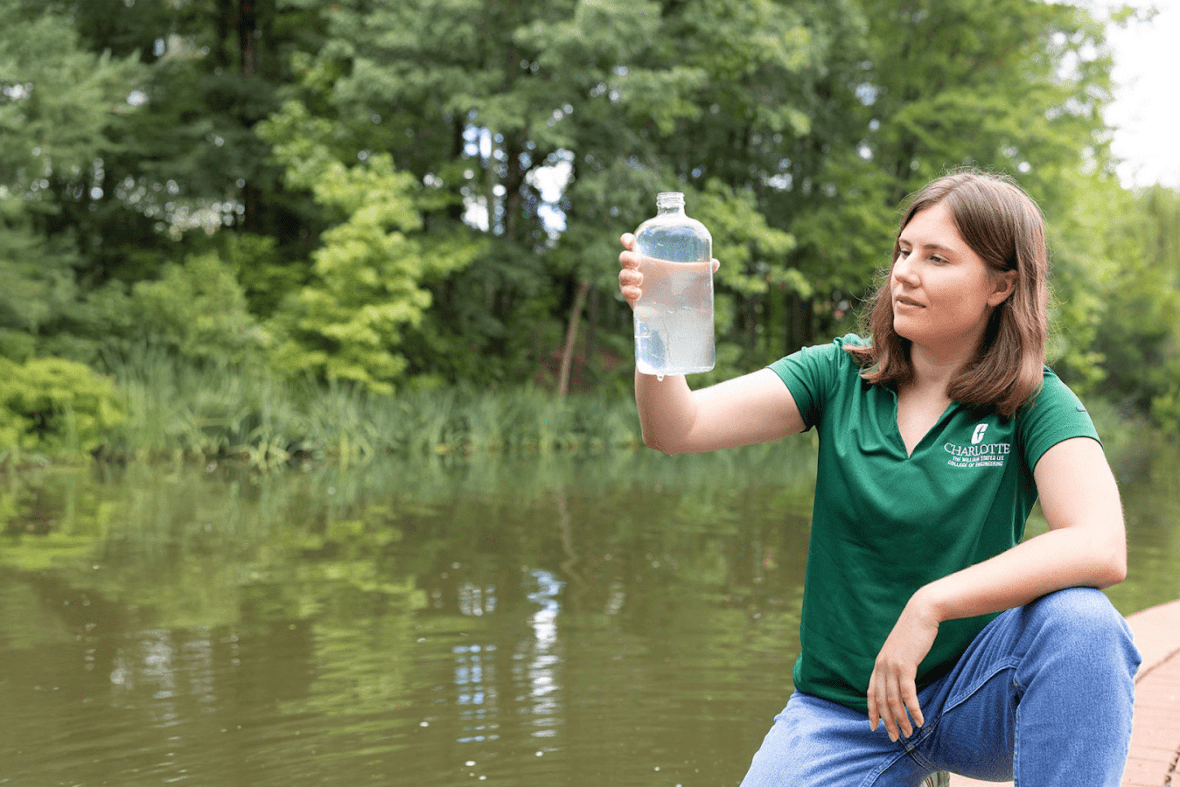Jordan Landis ’24 takes a hard look at a water sample before placing it under a microscope to examine.