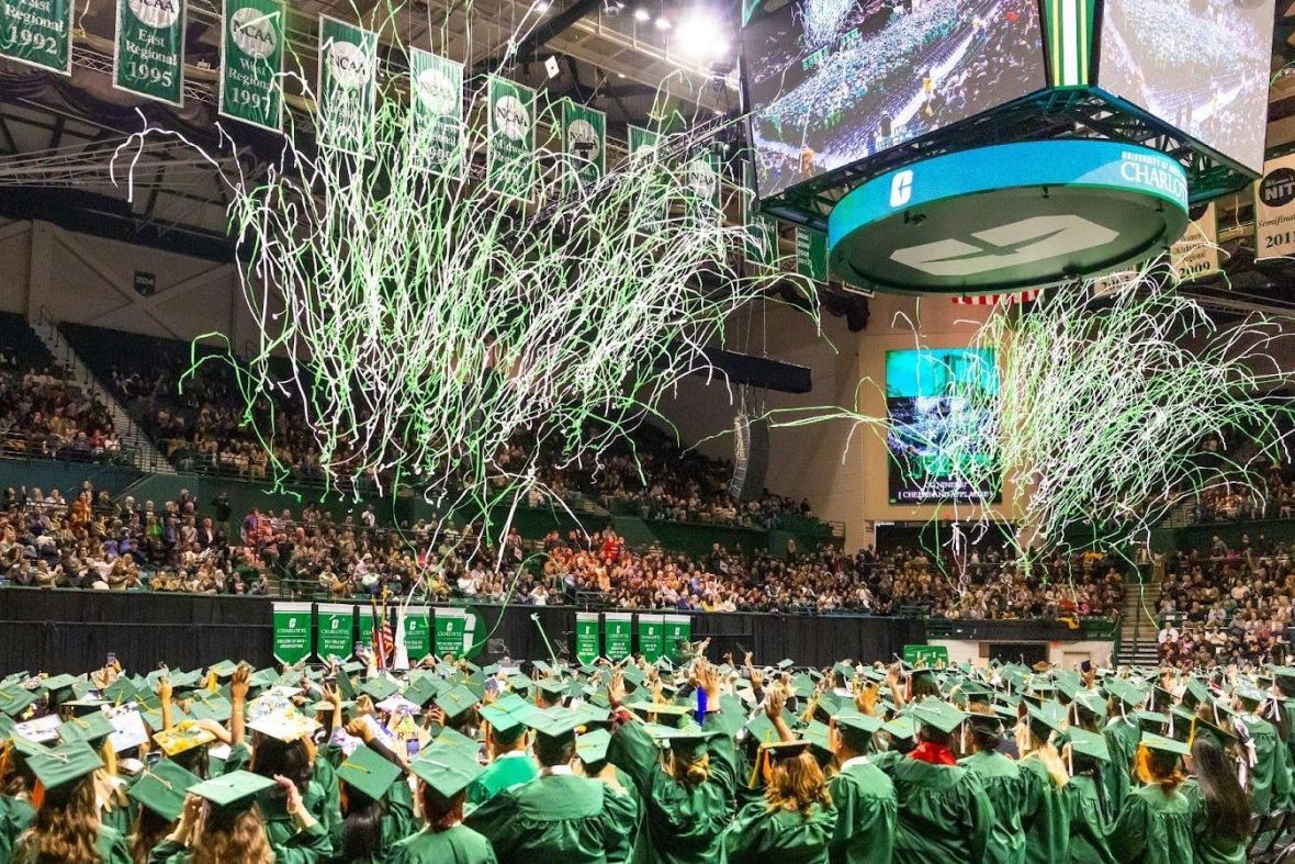 Graduating Students at graduation in basketball stadium