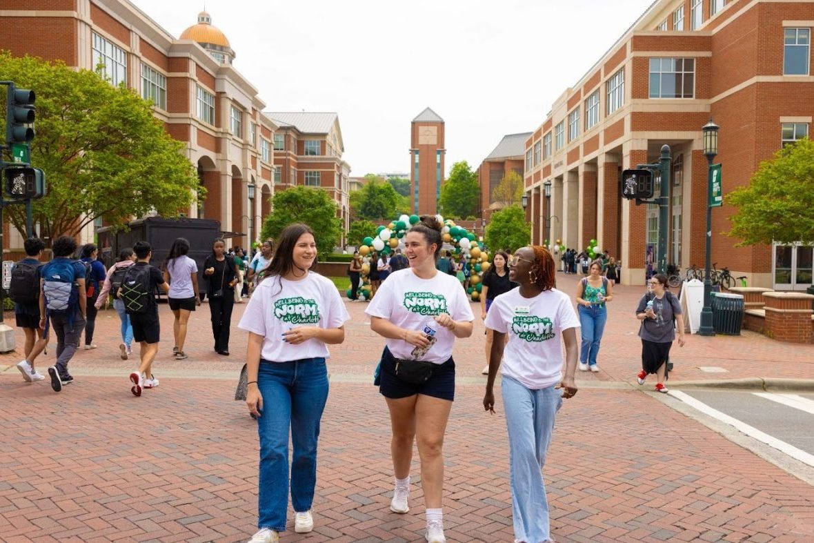 Three students walking on campus